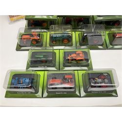 Eighteen issues of Tractors and The World of Farming magazine, together with sixty diecast tractors, all in original packaging, in three boxes 