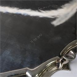 Early 20th century large silver salver, of circular form with Chippendale style rim, upon four hoof feet, hallmarked Elkington & Co Ltd, Birmingham 1918, D47cm