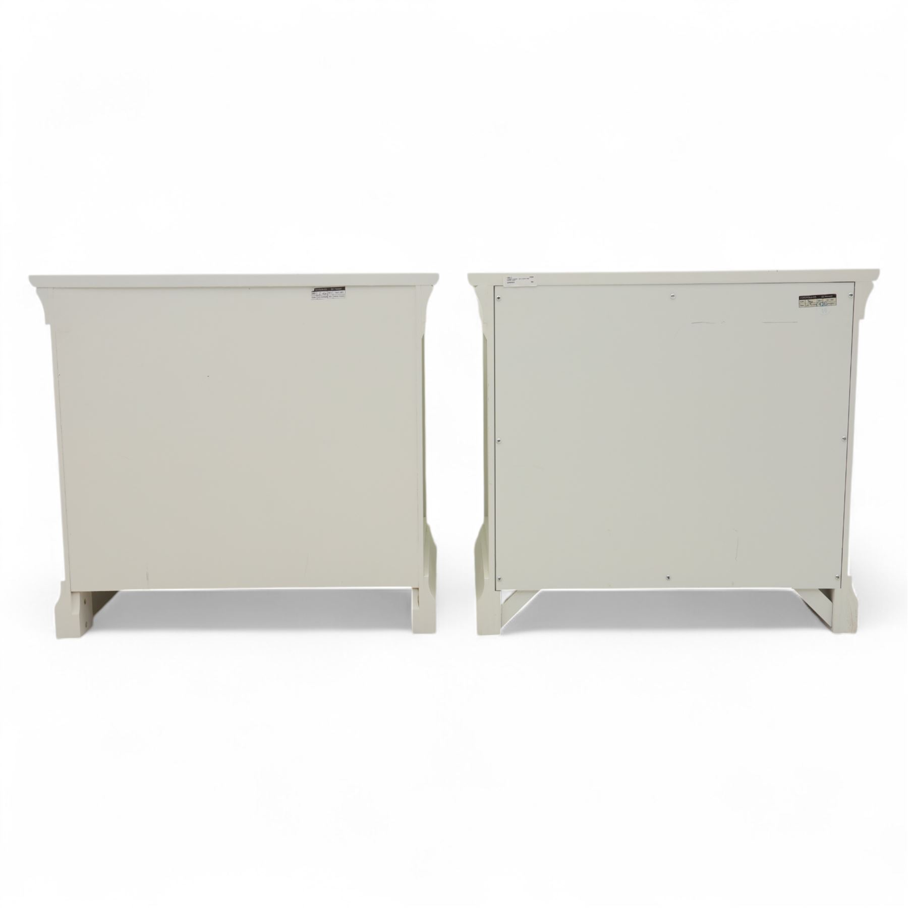 Coxwold Company - pair of white painted jumbo bedside cabinets, with two deep drawers and chrome knob handles,  shaped apron base