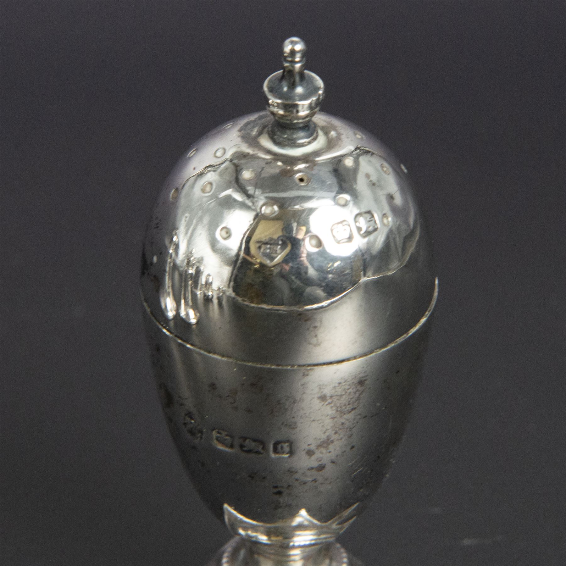 Group of silver cruets, including a pair of Edwardian conical shaped salt and pepper shakers and four other salt/pepper shakers, all hallmarked 