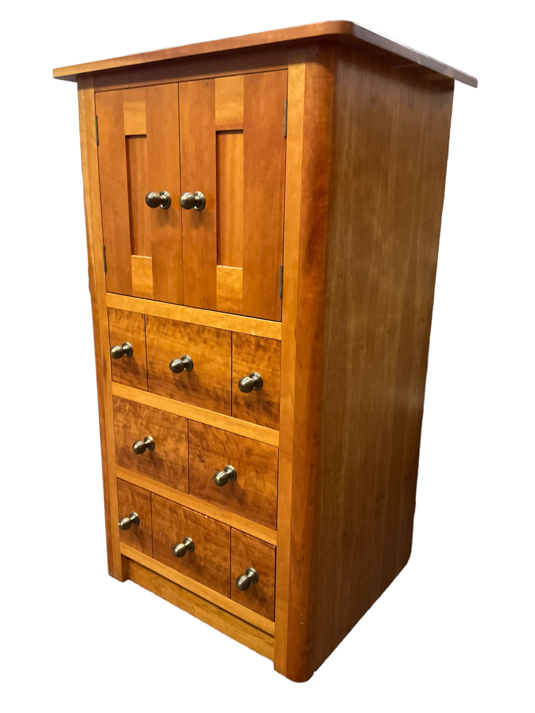 Cherry wood cabinet, fitted with double cupboard over two short and two long drawers, with faux drawer facias