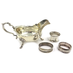  Silver sauce boat Birmingham 1906 and three hallmarked silver  napkin rings approx 6.5oz   