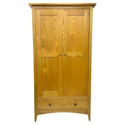 Light oak wardrobe, adjustable clothes rail and single shelf above a single drawer on squared splayed legs