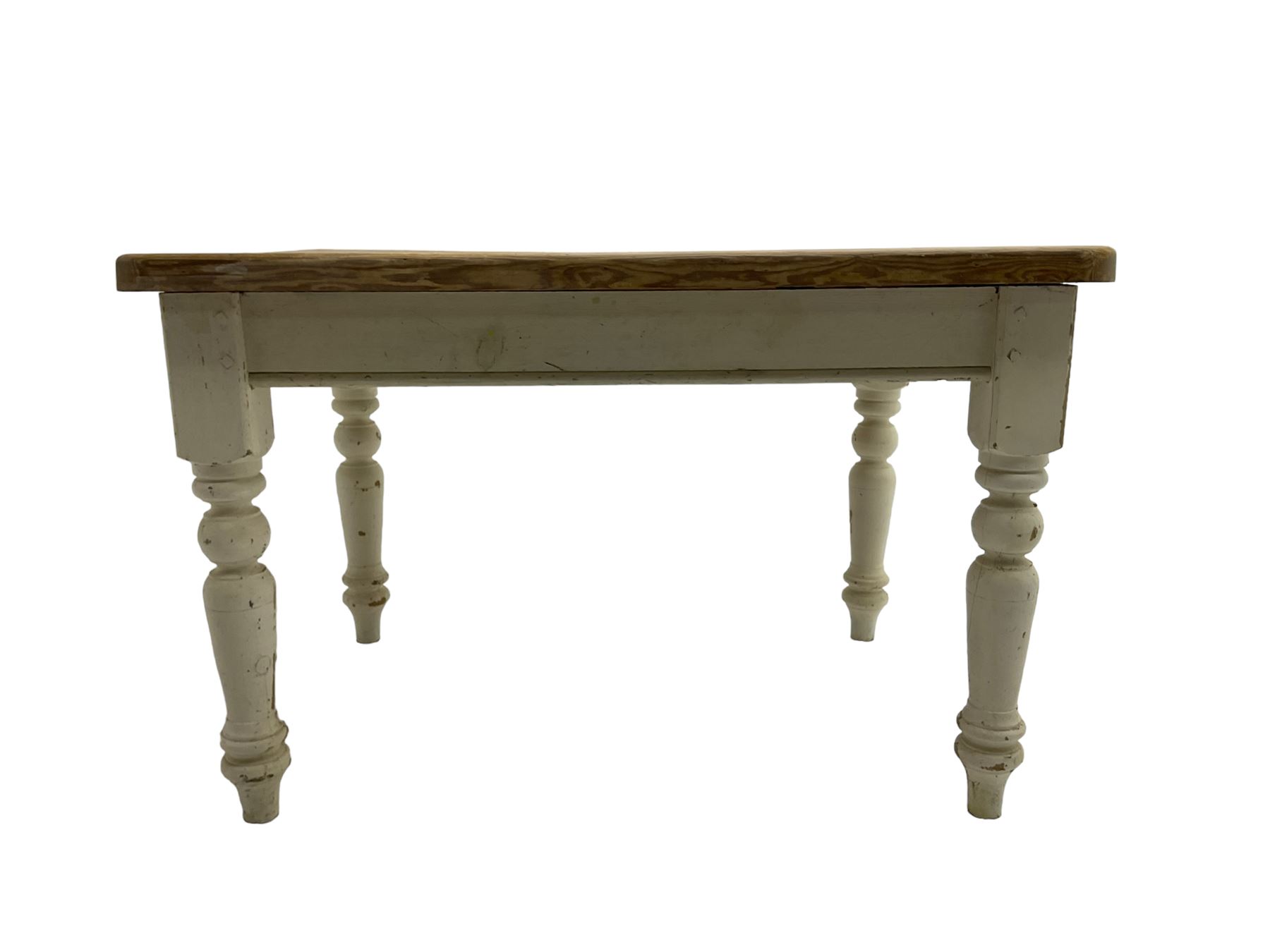 Traditional pine kitchen table with white painted base, rectangular top over single drawer, raised on turned supports