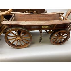 Four Melba Ware Shire horse figures and another similar, and three wood carts