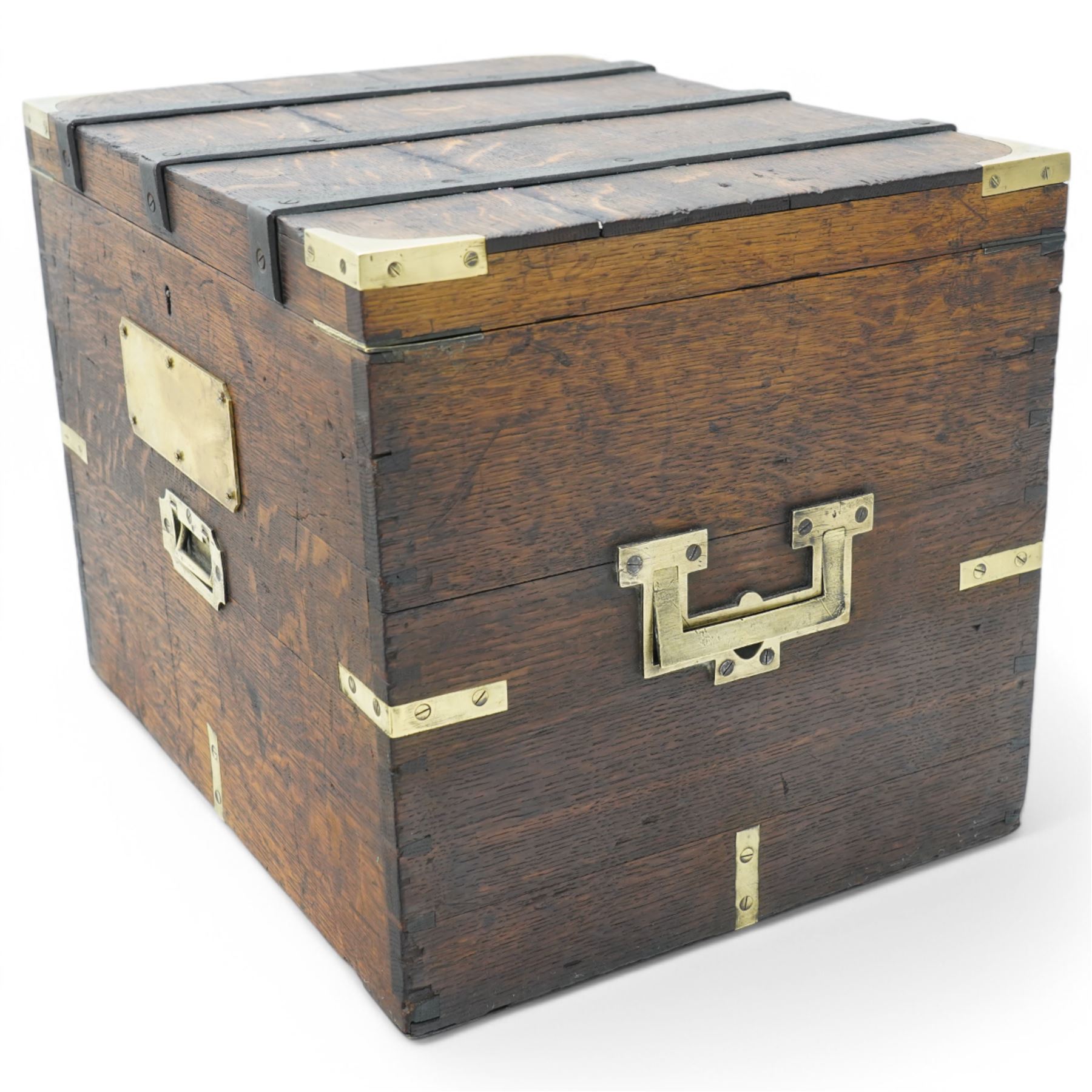 19th century oak and metal bound box, hinged lid enclosing vacant interior, bound with wrought metal straps and fitted with brass corner caps, two heavy weight brass carrying handles 