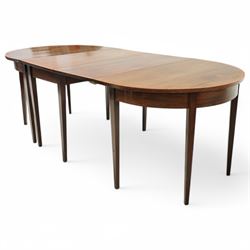 George III and later mahogany extending dining table, two D-ends, central drop-leaf table and loose leaf, satinwood banded tops, on square tapering supports with boxwood stringing