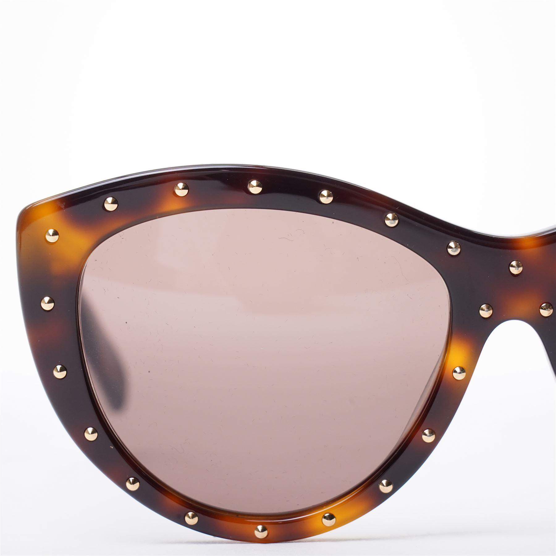 Alexander McQueen - pair of oversized sunglasses, with tortoiseshell-effect acetate frames and gradient tinted lenses, the fronts studded with gold-tone metal rivets, the arms signed ‘Alexander McQueen’, with original hard case and box