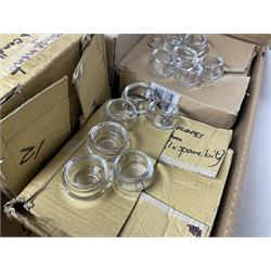 Fourteen bevelled mirror plates, D30cm, together with approximately twenty four glass candle sticks and a large quantity of glass candle collars and tealight holders, in three boxes