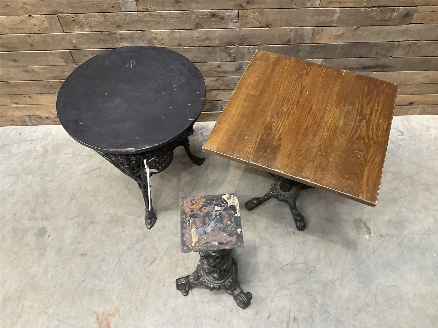 Cast iron Britannia circular pub table, and two pedestal cast iron bases (3)