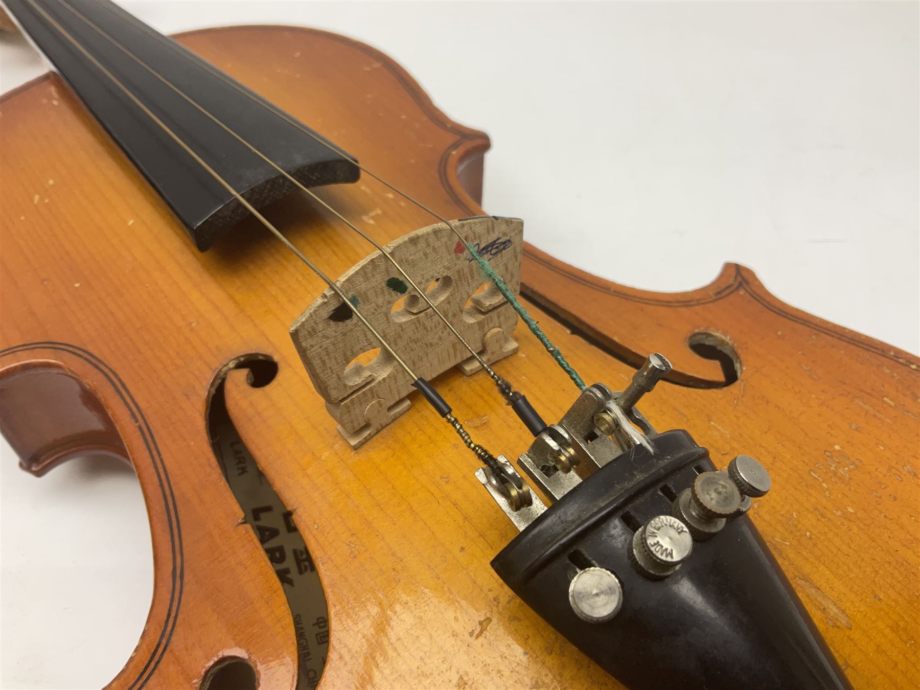 Four Chinese graduated violins - full size with 35.5cm two-piece back; three-quarter size with 33.5cm two-piece back; half size with 31cm two-piece back; and quarter size with 27.5cm two-piece back; all cased except full size; one with bow (4)