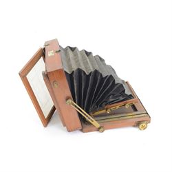 UNABLE TO SELL Two mahogany and brass half plate cameras, comprising E & T Underwood camera and a Taylor's Drug Co. Ltd 'The Albion' camera, each with Thornton Pickard 'Snap Shot' lenses, all with ivory maker's plaques, with a glass plate and a canvas carry case