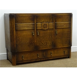  Early 20th century medium oak sideboard, three cupboard doors, carved rose detail, two long drawers, reeded supports, W122cm, H87cm D47cm  