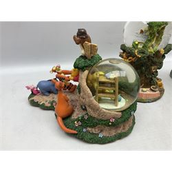 Five Disney Winnie The Pooh snow globes to include The Rain Rain Rain Came Down Down Down, Eeyore Pulling Cart, Owl's House, Rumbly in My Tumbly and Stuck In Rabbit's House, together with figure group with dome, five with boxes (6)