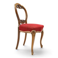 Set of five Victorian mahogany dining chairs, the scalloped balloon back with pierced scrolling acanthus leaf decoration, sprung seats upholstered in crimson fabric, on cabriole supports