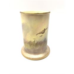 A Crown Devon Fieldings vase, of cylindrical form painted with a highland cattle scene and signed Cox, with printed marks beneath, H11.5cm