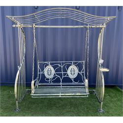 Large distressed silver finish metal garden swing bench, shaped canopy top, two seat bench set with floral and scroll decoration  - THIS LOT IS TO BE COLLECTED BY APPOINTMENT FROM DUGGLEBY STORAGE, GREAT HILL, EASTFIELD, SCARBOROUGH, YO11 3TX