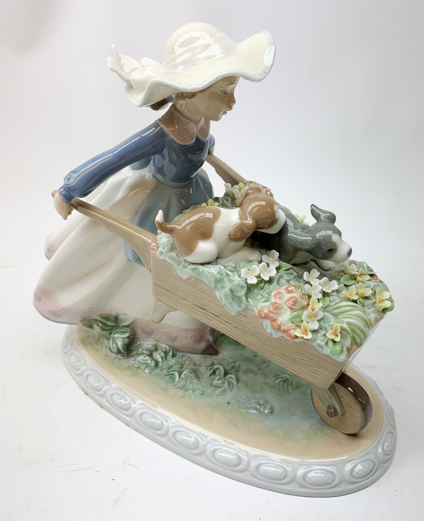 A Lladro figurine, 'Barrow of Fun' Model 5460, H20.5cm, together two further Lladro figurines, 'Litter of Fun' Model 5364, and 'It wasn't me' Model 7672. 