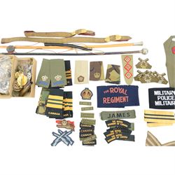 Large collection of militaria items, including RAF dog tags, The Royal Grenadiers belt buckle, Royal Regiment of Canada swagger stick, insignias including marksman badge etc