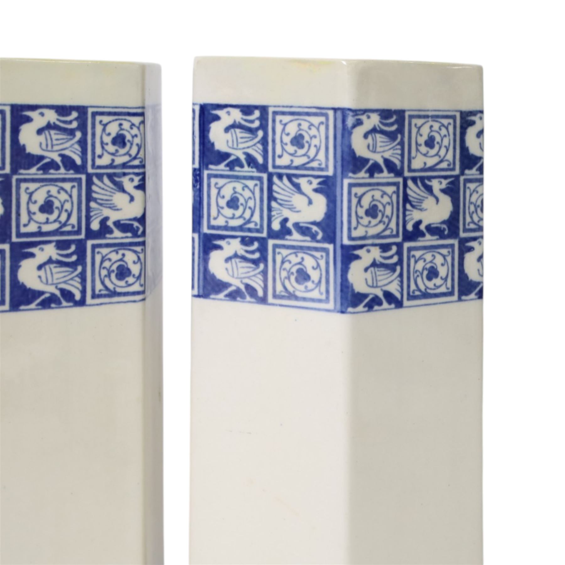 Pair of 1920's Art Deco Royal Doulton lustreware hexagonal vases, with boards of checkerboard design of alternating bird and scroll motifs, designed by Reco Capey, H28cm