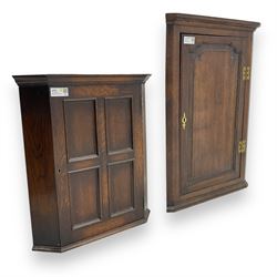 Early 20th century wall mounted oak corner cabinet, moulded cornice over panelled door enclosing single fixed shelf (W60cm, D40cm, H66cm); 19th century oak corner cabinet, panelled door enclosing three shaped shelves (W65cm, D35cm, H92cm)
