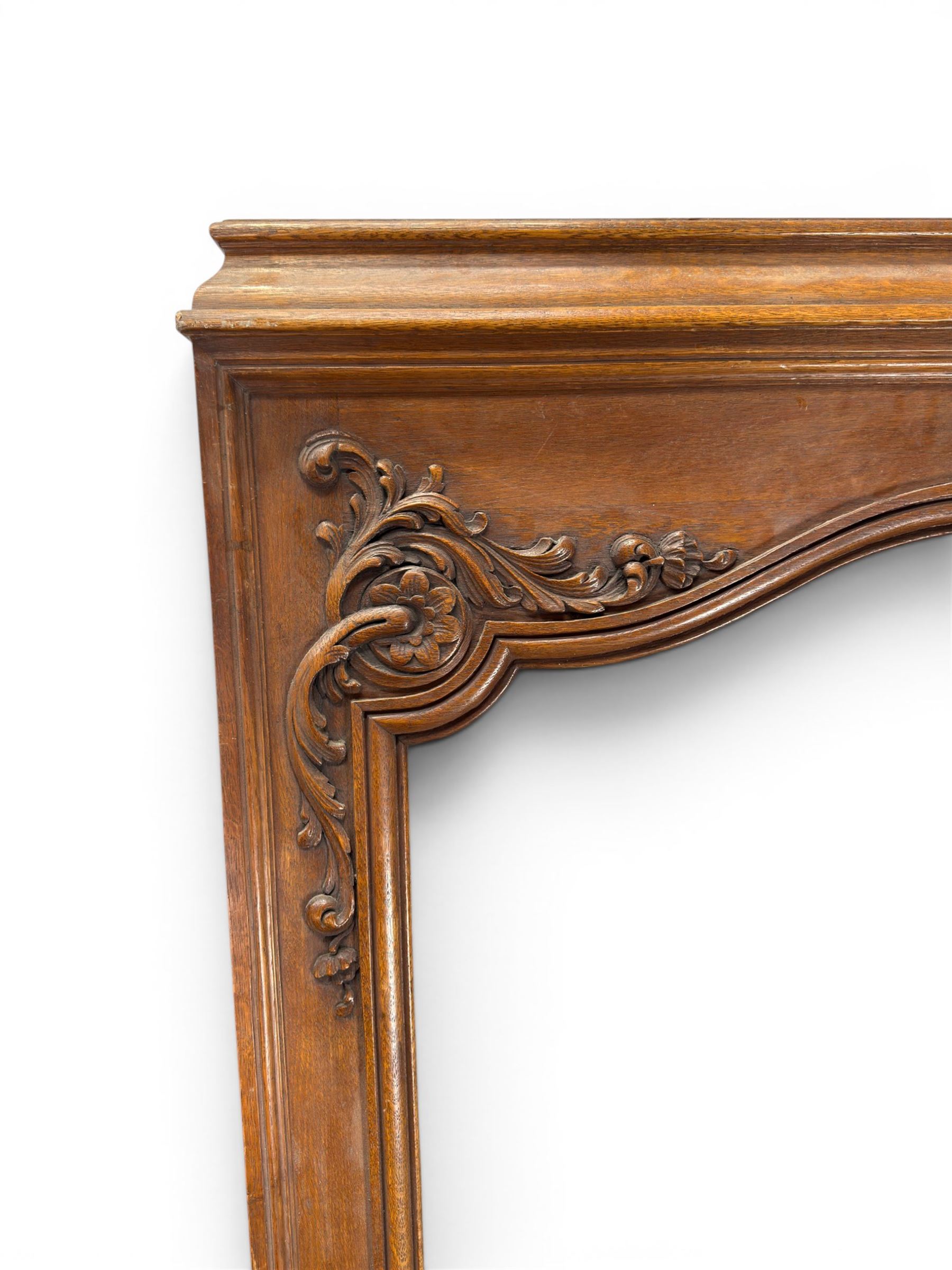 Early 20th century French oak window surround, shaped top with carved shell and acanthus leaf detail 