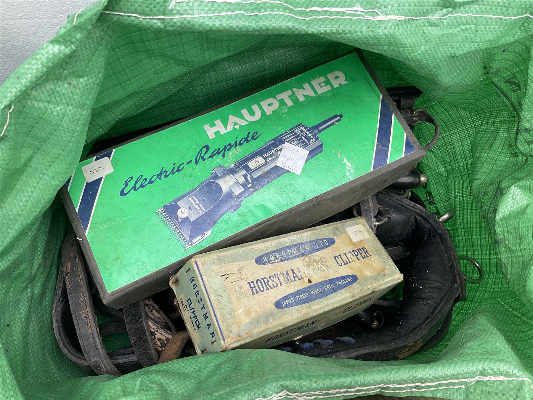 Quantity of horse tack and equipment to include Hauptner electric horse clippers, The Horseman Electric Clippers, bits, bridles, girths, rugs, jodpa boots etc  