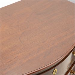 George III mahogany serpentine chest, moulded top over four cock-beaded drawers, the top drawer fitted with baize lined slide opening to reveal divisions,  enclosed by canted and fluted upright corners, the drawer fronts fitted with brass swan neck handles and circular plates with oval escutcheons, lower moulded edge over bracket feet, on lignum vitae castors