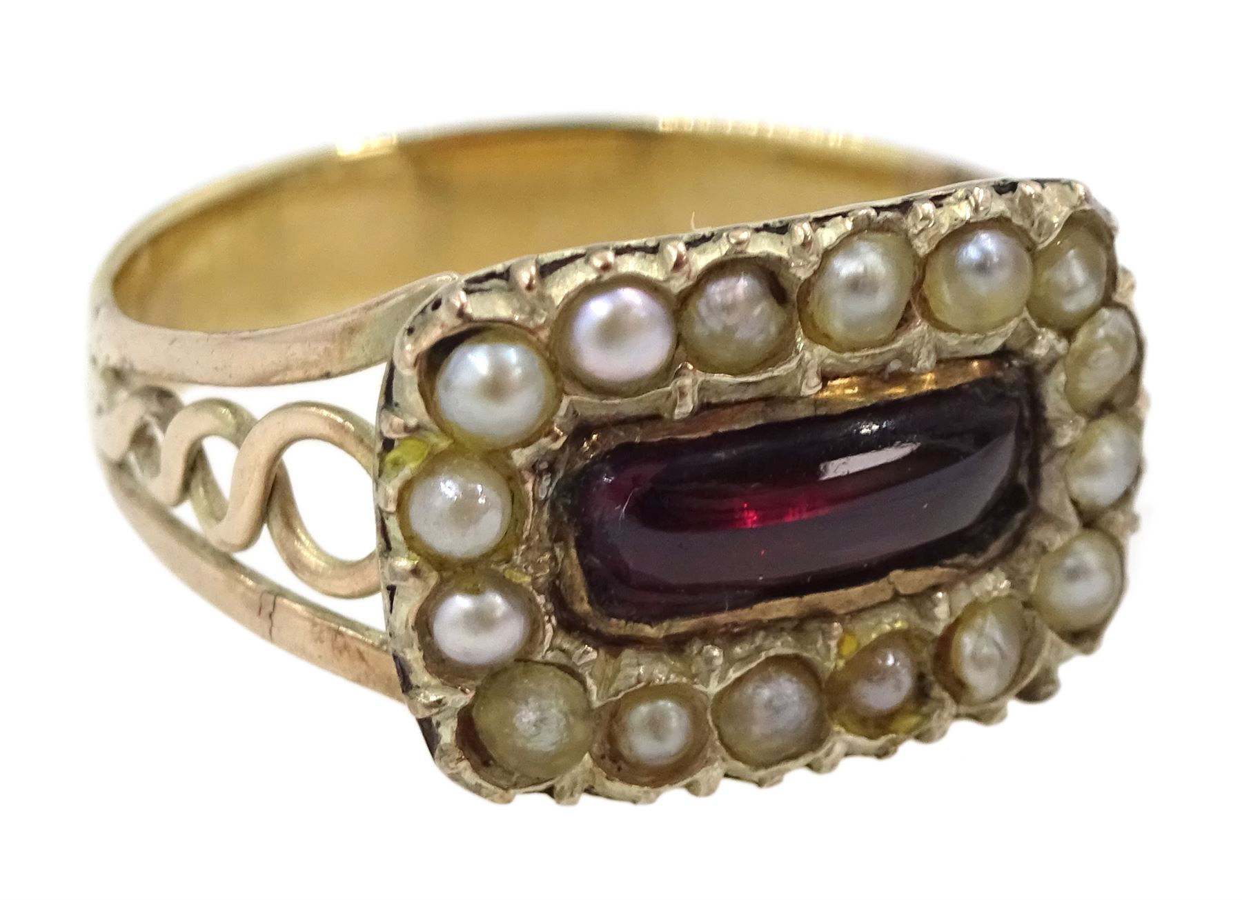 Victorian 9ct gold oval cut blue topaz brooch and a 9ct gold Victorian cabochon garnet and seed pearl ring