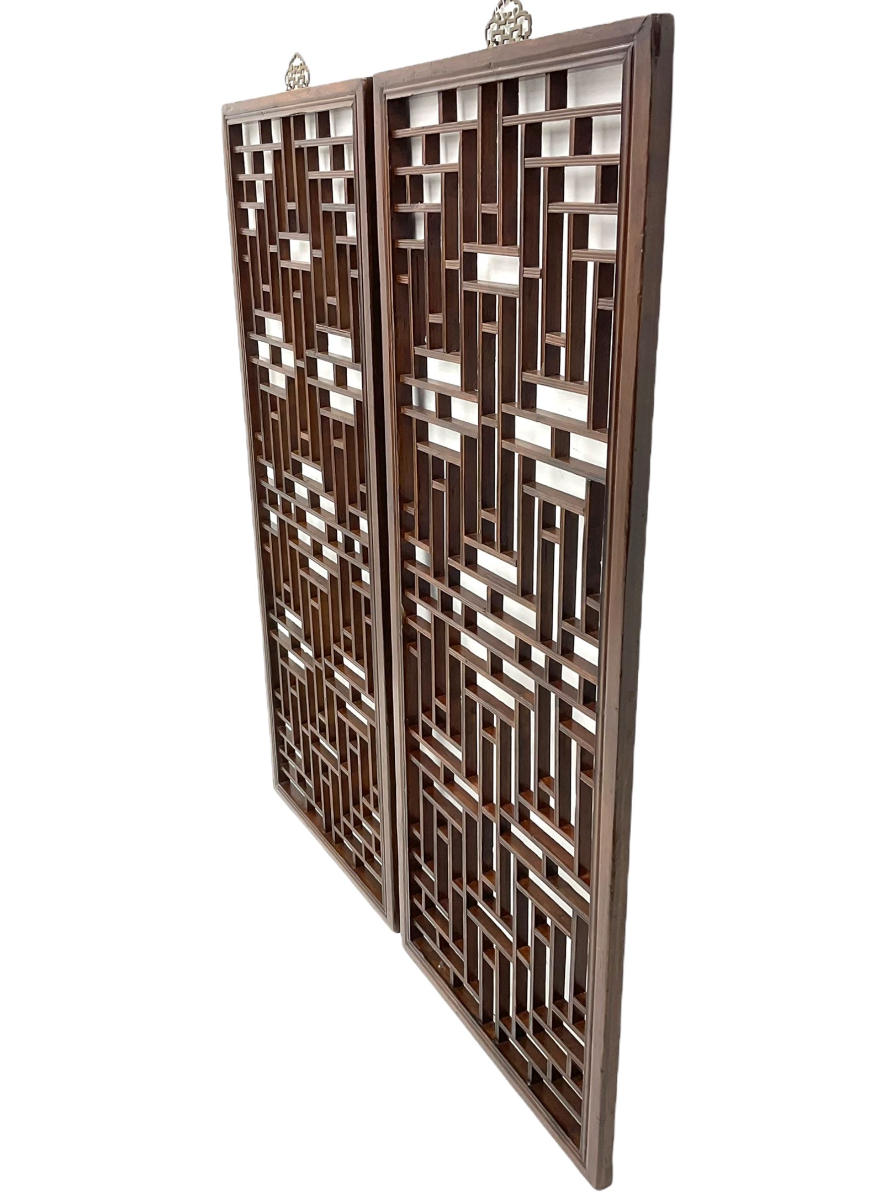 Pair 19th century Chinese lattice wall panels, in moulded frames with metal hangers, the lattice work with reed moulding