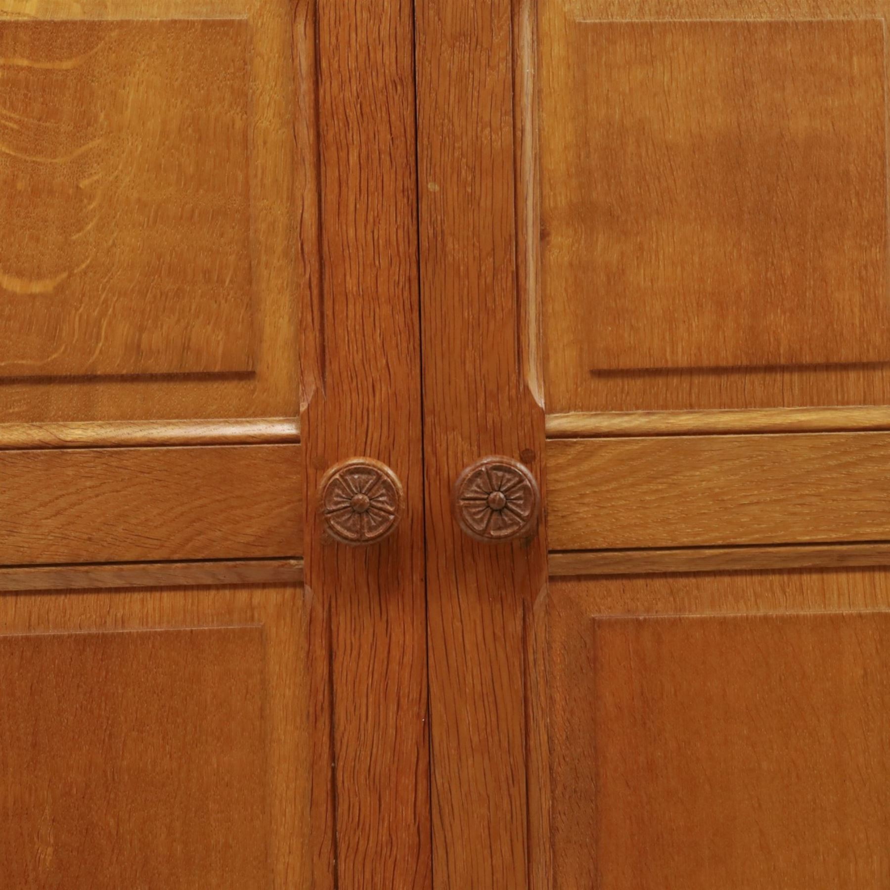 Beaverman - oak double wardrobe, enclosed by twin multi-panelled doors, Yorkshire Rose carved handles, the interior fitted with shelf and hanging rail, with signature carved beaver, by Colin Almack of Sutton, near Thirsk