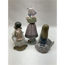 Three Lladro figures, comprising Pondering, no 5173, Nostalgia, no 5071 and Nature's Bounty, no 1417, all with original boxes, largest example H27cm
