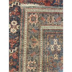 Persian Hamadan red ground rug, the field decorated with floral motifs with central lozenge medallion, guarded border decorated with repeating stylised plant motifs