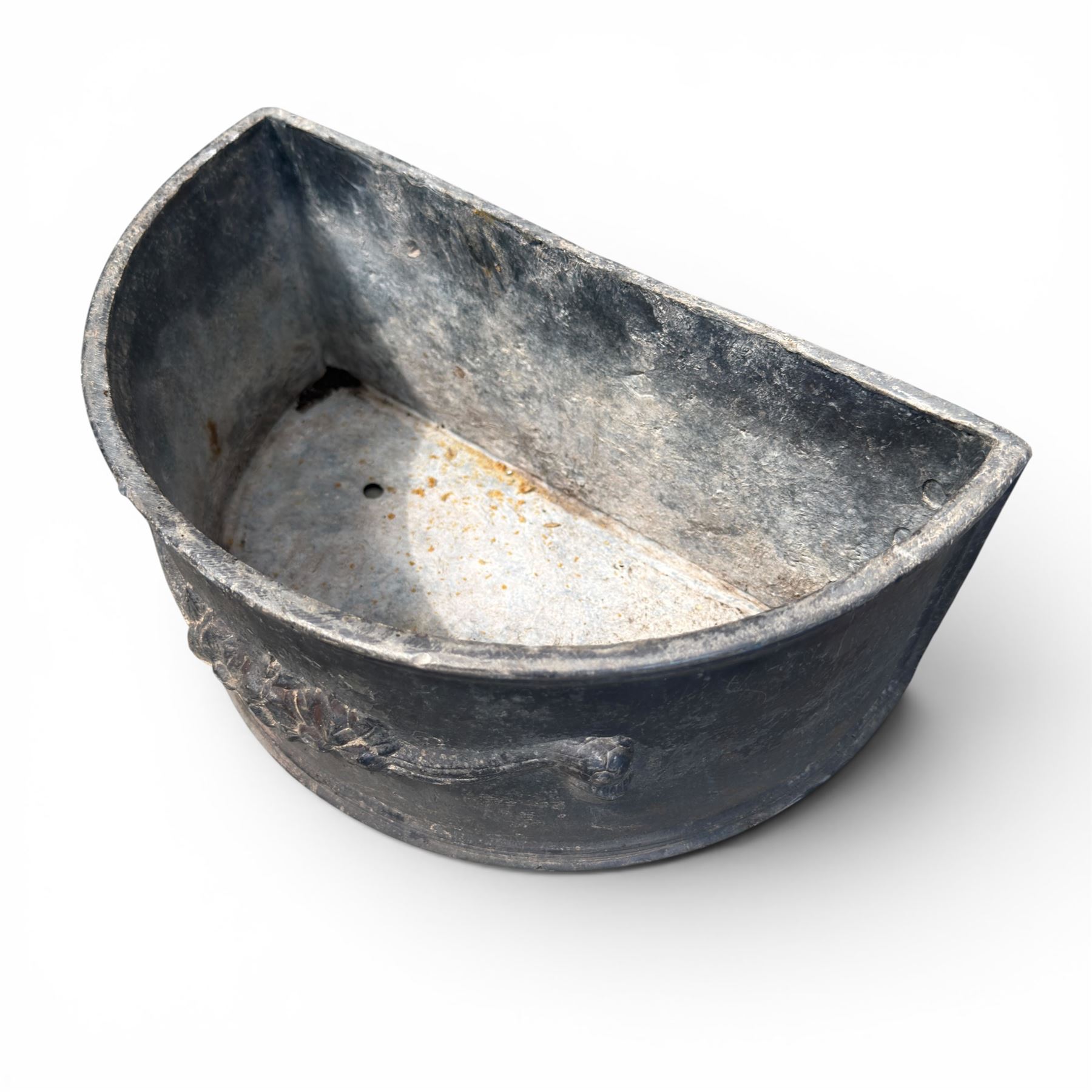 Pair of 19th century decorative lead planters of demi-lune form, decorated with raised relief floral swag decoration