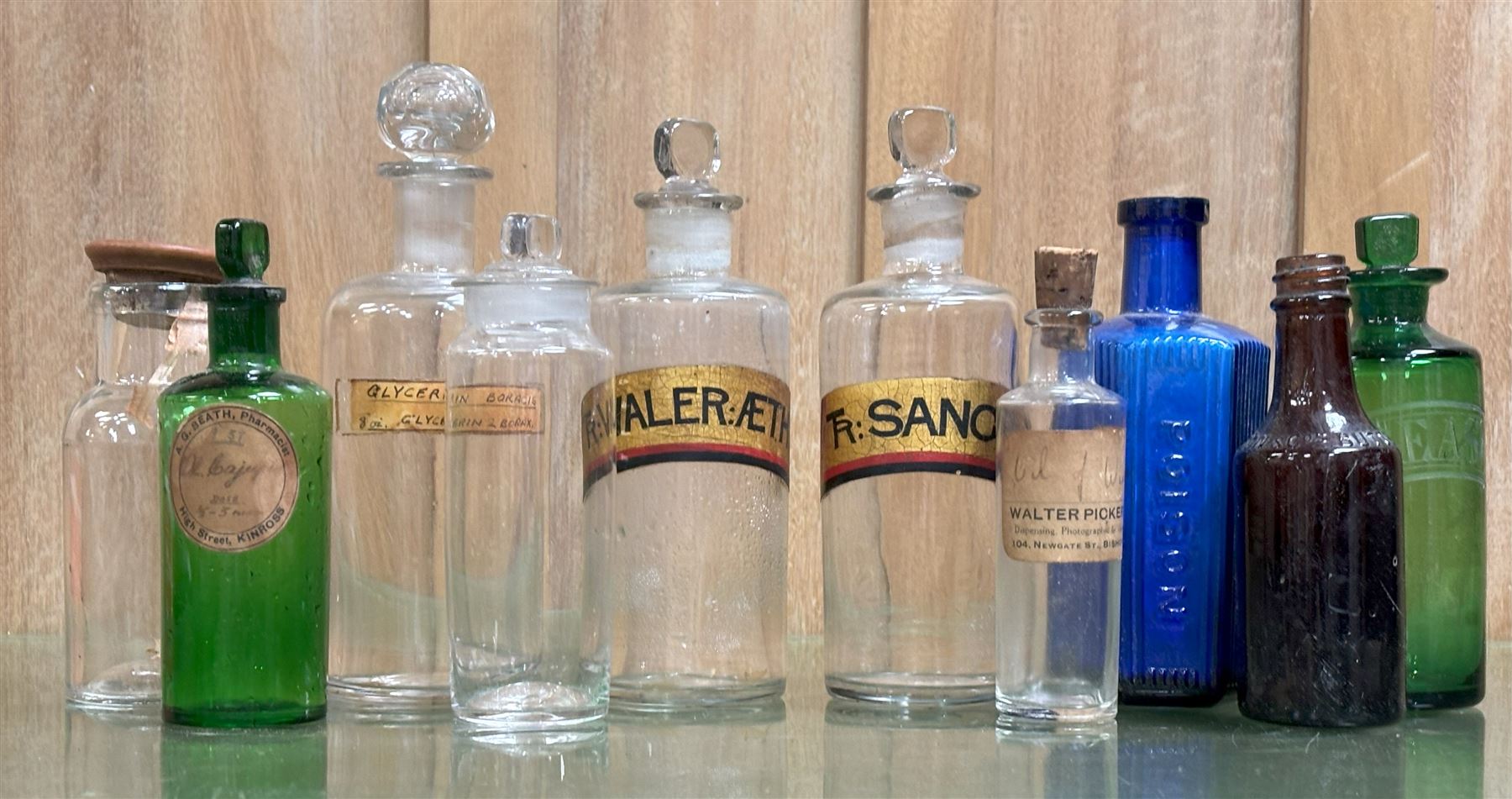 Collection of ten glass chemists bottles, largest H19cm. - COLLECTION BY APPOINTMENT FROM: The White House, Thirsk Road, Easingwold, York, YO61 3NF - CALL 01723 507111 TO ARRANGE