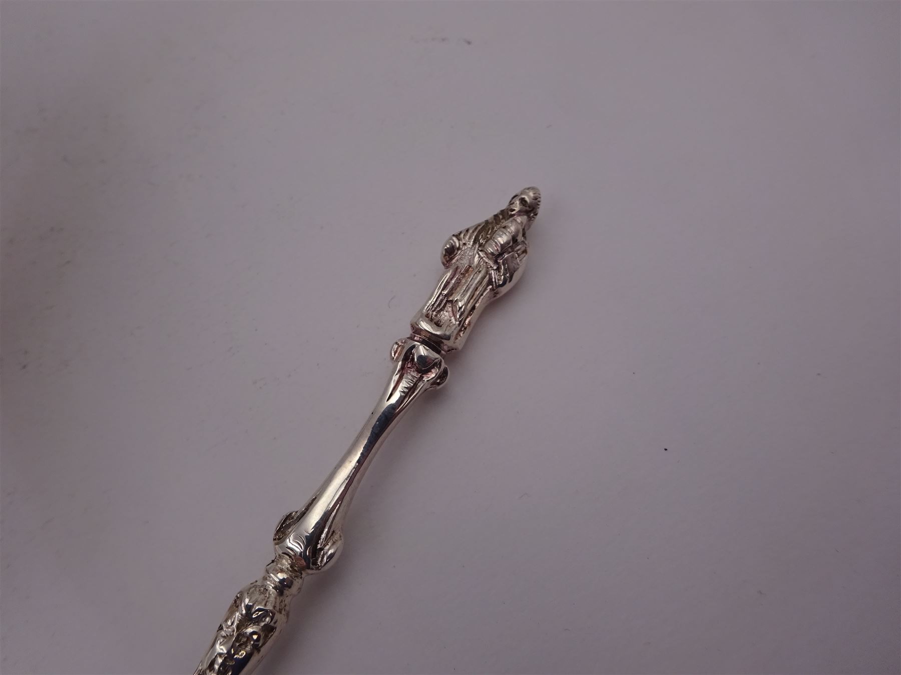 Victorian silver bowl, with embossed floral decoration and beaded rim, gilt interior and two applied shield cartouches, upon stepped circular foot, with a silver apostle spoon, with gilt bowl, both hallmarked George Unite, Birmingham 1883, bowl H5.5cm, within fitted tooled leather, silk lined case