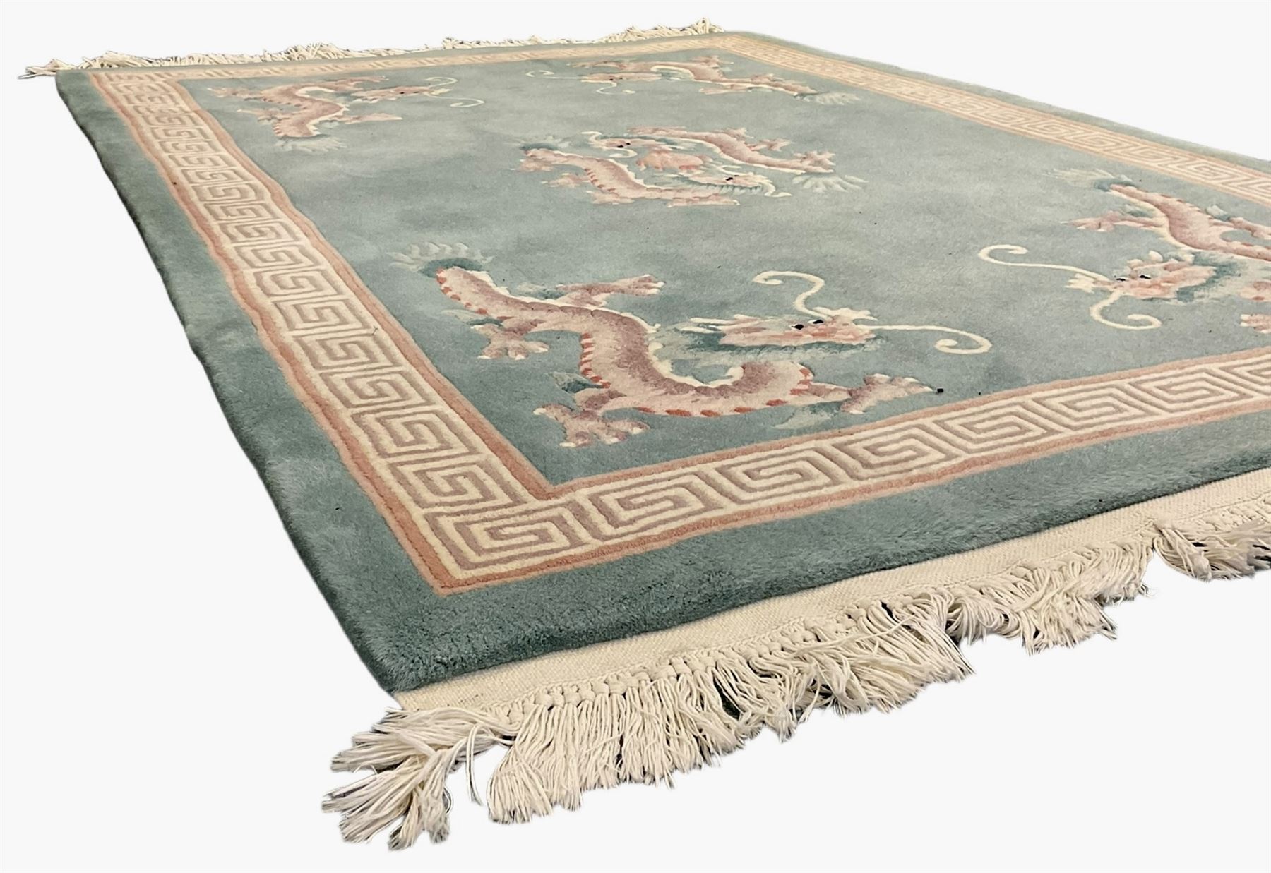 Chinese jade ground woollen rug decorated with dragons 
