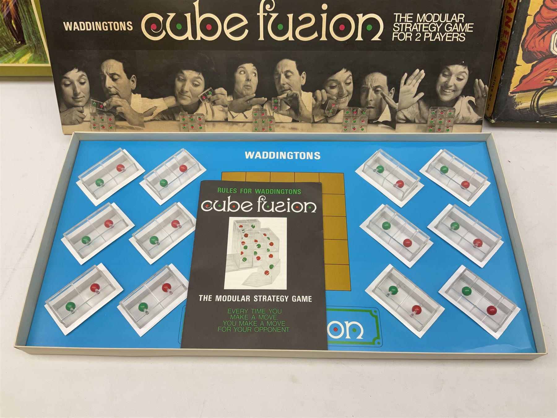 Meccano - Set No.5 with instruction booklets and Set 1+1X Conversion Set; both boxed; Adman Grandstand TV Game; boxed; Parker Colditz Board Game; and four Waddingtons Board Games including Cube Fusion, Totopoly, Golf Winks and Buccaneer; all boxed (8)