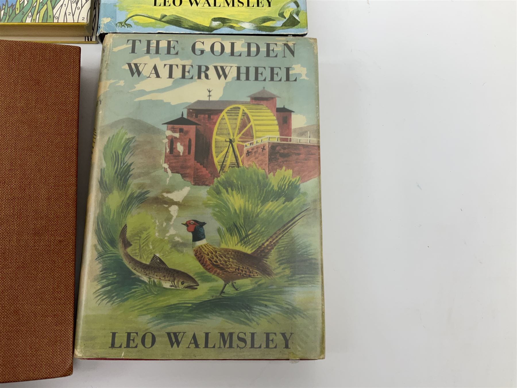 Leo Walmsley: a collection of Novels mostly 1st ed. including Phantom Lobster, signed by the author, Love in the Sun, The Happy Ending, Angler's Moon, Sally Lunn, The Silver Blimp, Love in the Sun, Paradise Creek, Fishermen at War, Golden Waterwheel, Sound of the Sea, etc (16)