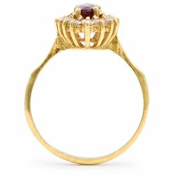 18ct gold ruby and diamond cluster ring, single marquise cut ruby of approx 0.90 carat, surrounded by sixteen round brilliant cut diamonds, stamped 750