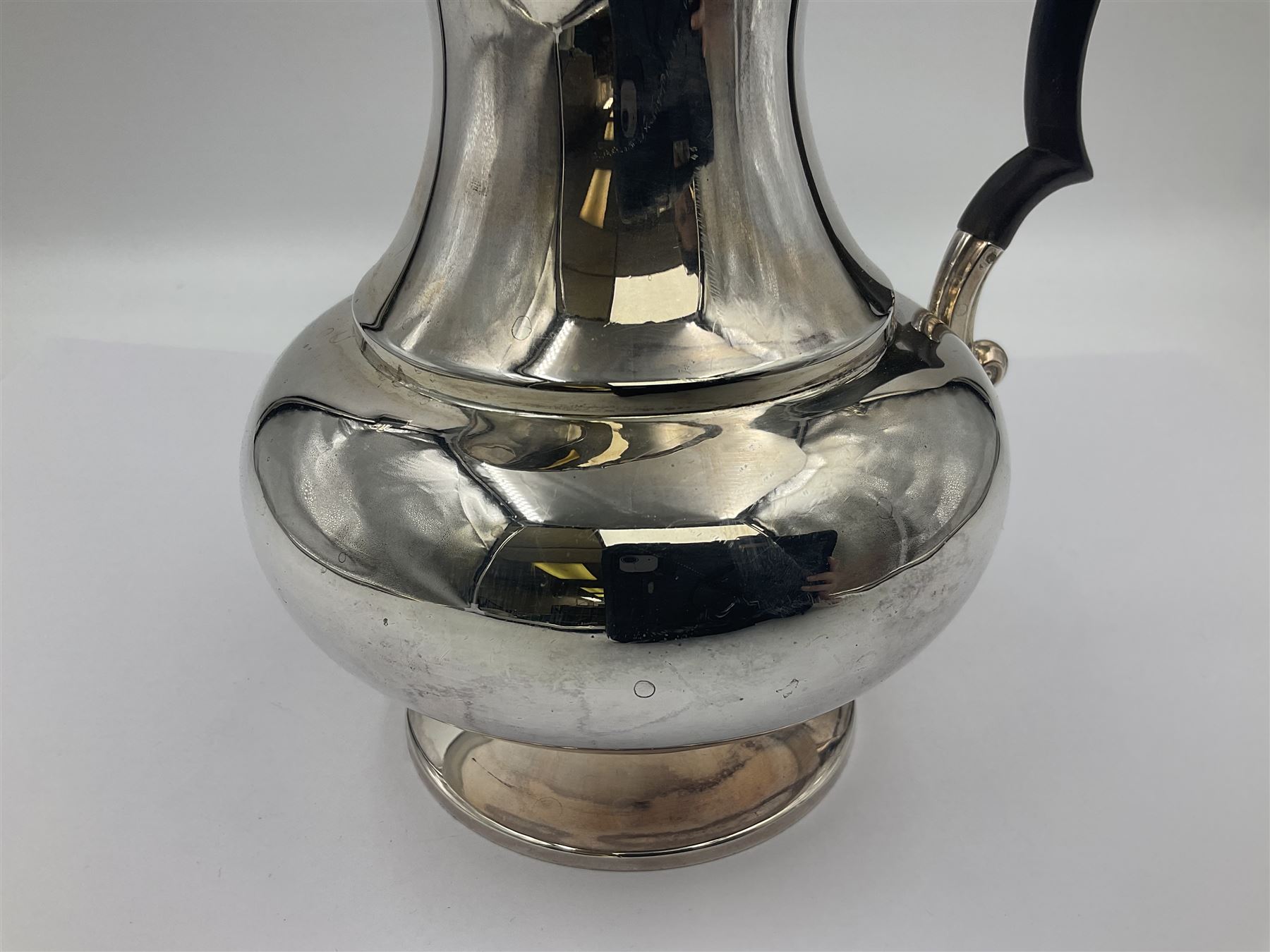 1920s five-piece silver tea service, comprising teapot, coffee pot, hot water pot, twin handled open sucrier and milk jug, each of squat circular form with shaped rim, the teapot, coffee pot and hot water pot each with ebonised handle and finial, the sucrier and milk jug with acanthus capped scroll handles, all upon circular foot, hallmarked R F Mosley & Co, Sheffield 1926 & 1927, tallest H24cm