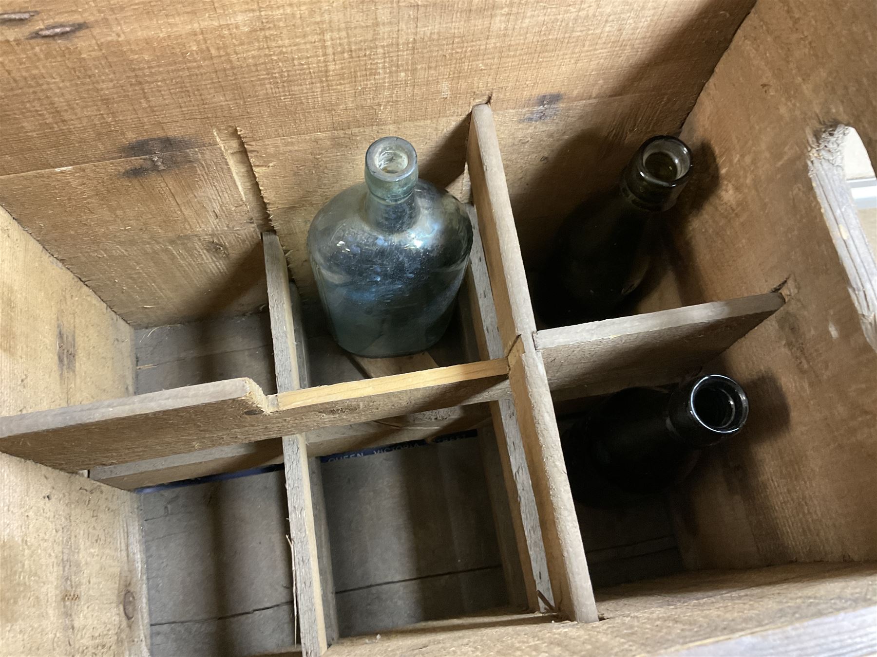 Two wicker baskets, three pine lidded bottle crates with quantity of glass bottles, comprising one with R.L. June & Co Ltd Mansfield black lettering and pair detailed Mandora Soft Drinks, Mappin & Webb blue cardboard box and framed With the Colours Punch 1924 print, larger basket W60cm