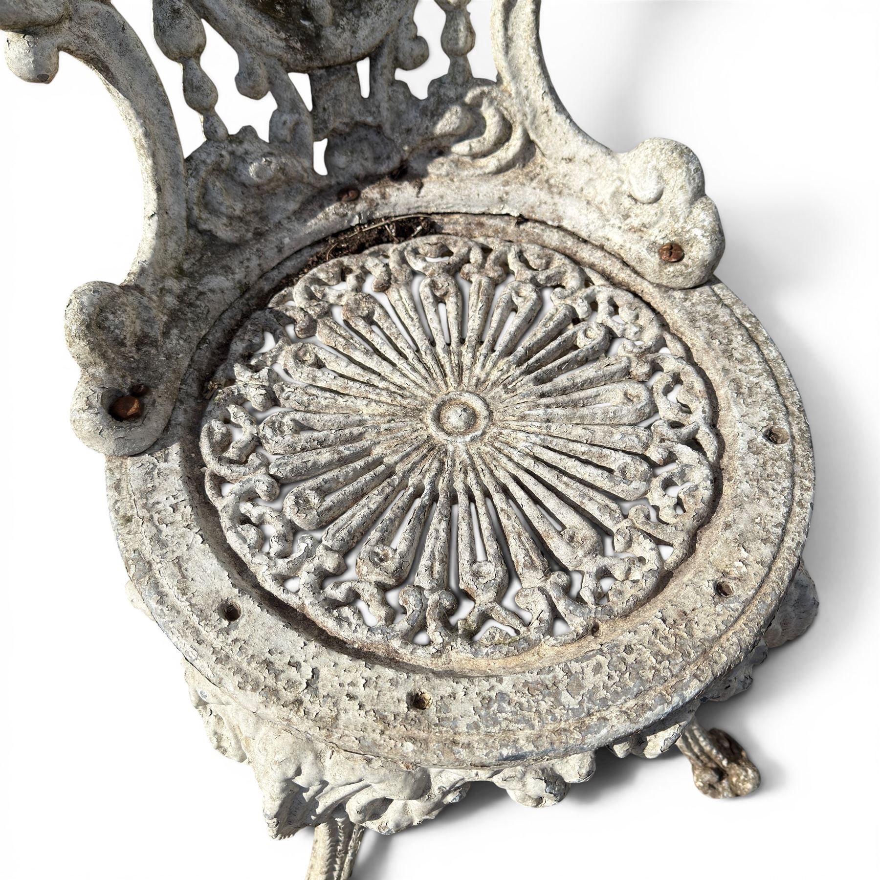 Pair of white painted cast metal garden chairs, ornate reclined backs, circular pierced seats on cabriole legs