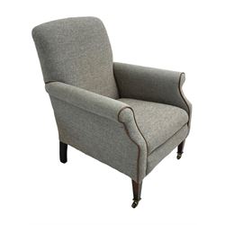 Interiors at Nine to Eleven - Edwardian design armchair, traditional shape with rolled arms, upholstered in 'Harris Tweed' fabric with leather piping, raised on square taping supports with castors
