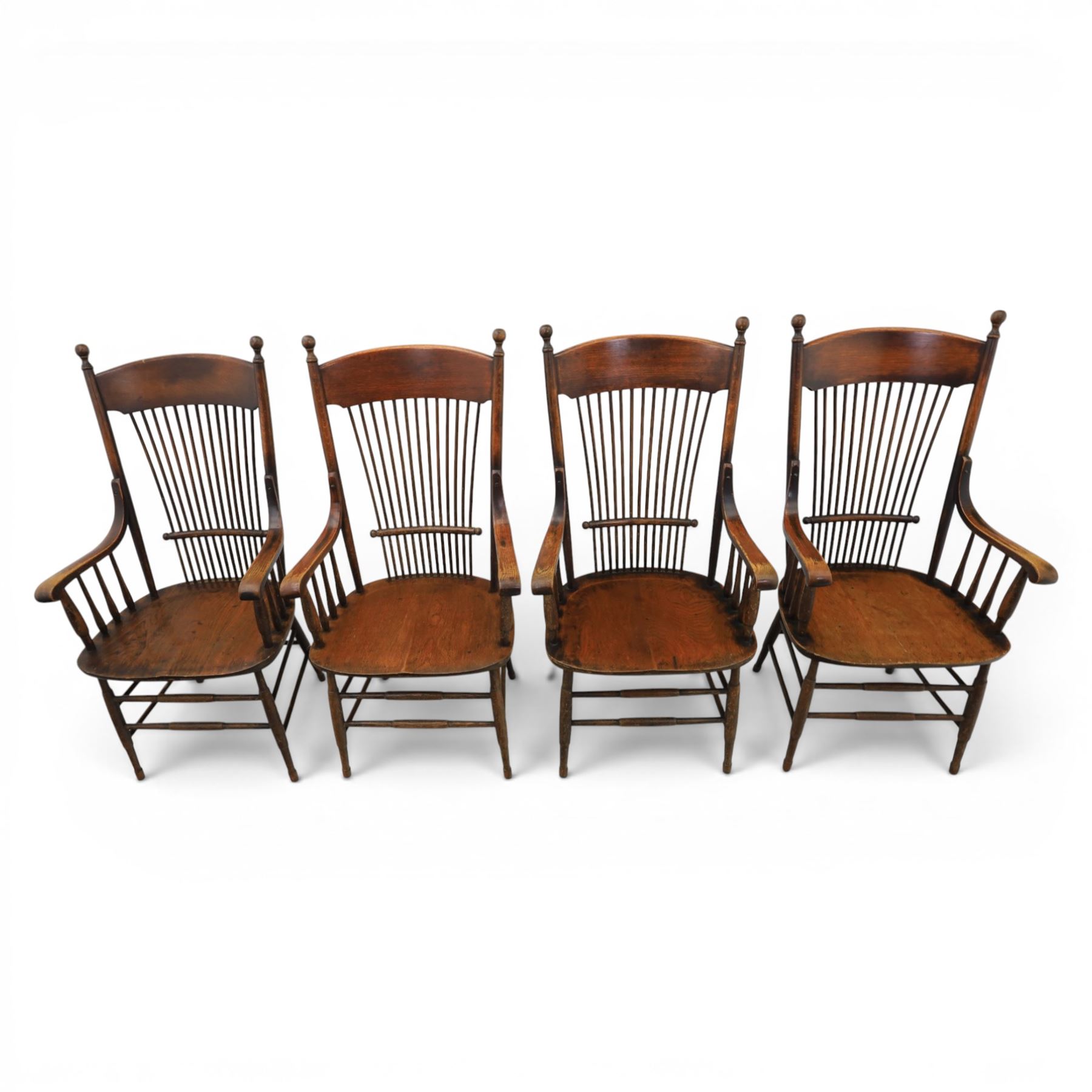 Set of eight 19th century ash and elm spindle back Windsor armchairs, arched top rails above fan-shaped spindle backs, curved arms with turned supports, shaped saddle seats, on turned legs joined by H-stretchers