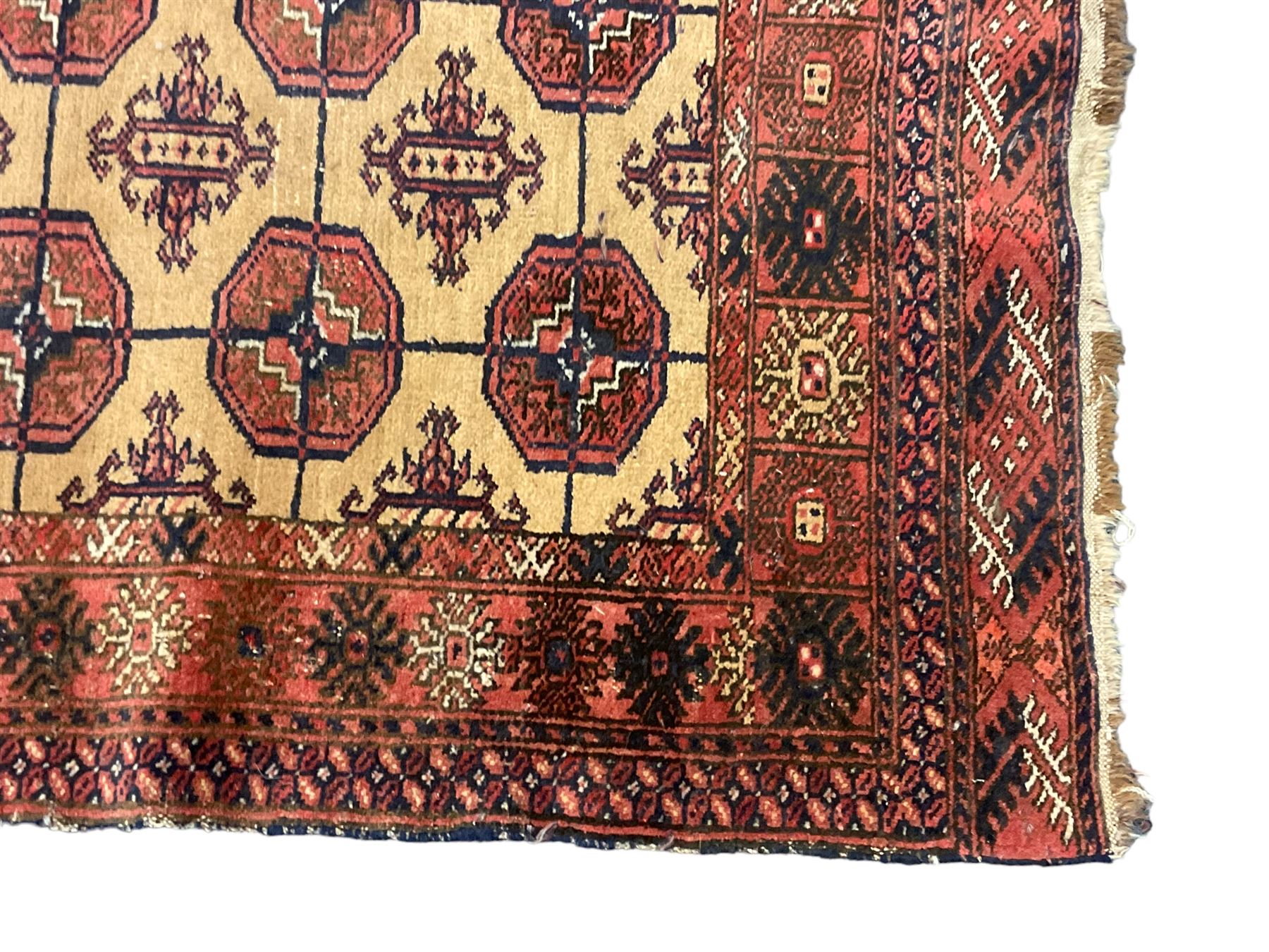 Old Afghan red ground rug, decorated with repeating bird motifs, the guarded border with candelabra pattern (150cm x 104cm); and antique Afghan burnt orange ground rug, field decorated with octagonal lozenges, repeating geometric border (134cm x 95cm) (2)