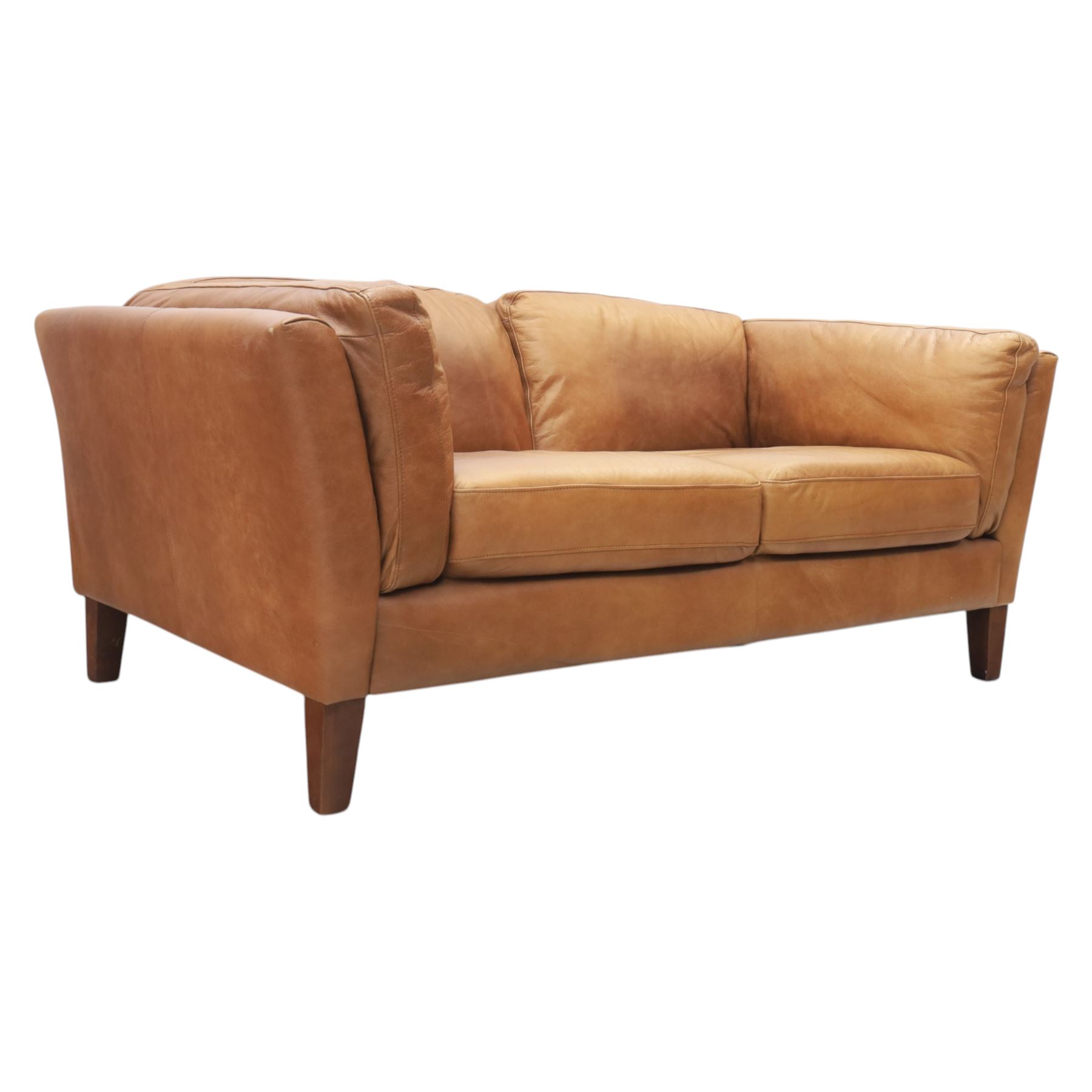 Two seat sofa upholstered in tan leather