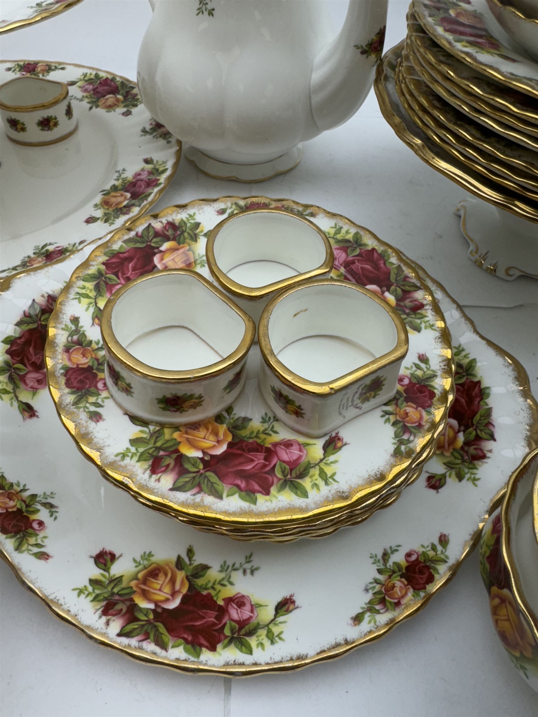 Royal Albert Old Country Roses pattern tea wares, comprising coffee pot, jug and sugar bowl, cake stands, napkin rings, teacups and saucers, side plates, dessert plates, small plates, all with printed marks beneath