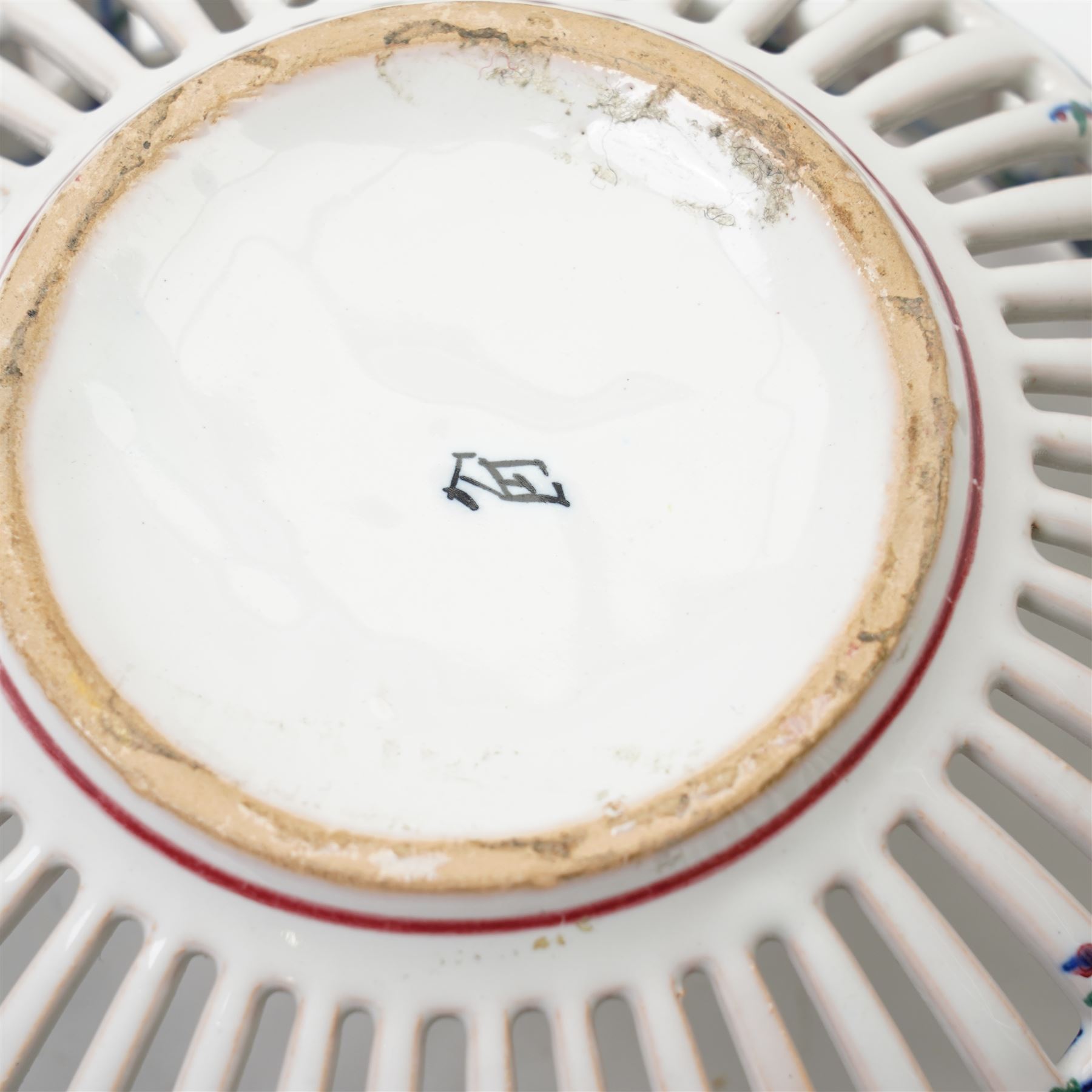 Two 20th century French faience openwork baskets, by Emile Tessier Malicorne, painted with polychromatic floral decoration, with scalloped rims, marked to base, larger 9cm (2)