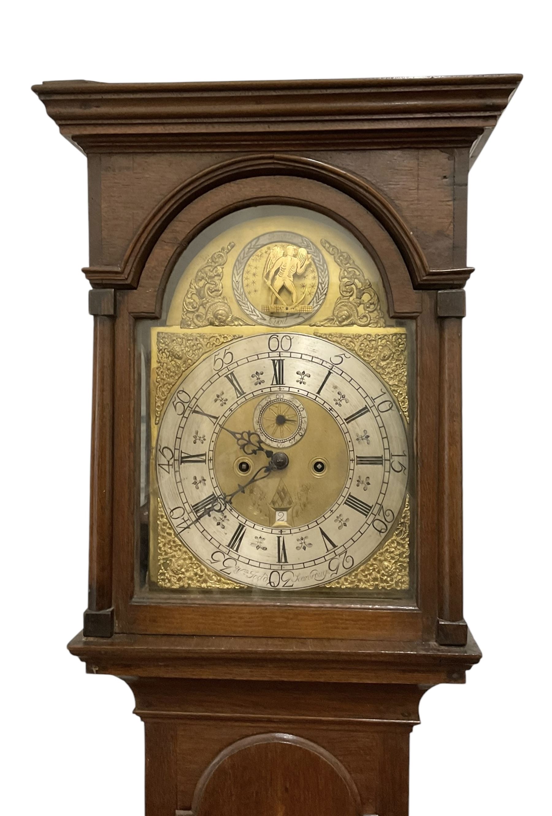 William Todd of Scarborough - early 18th century 8-day oak cased longcase clock c1730, with a flat top and deep cornice to the pediment, glazed side windows and a break arch hood door beneath with attached pilasters, long trunk door with an arched top on a reduced plinth with applied skirting, brass dial with cast spandrels and a father time automata to the arch, silvered chapter with Roman numerals and five minute Arabic's, quarter-hour and minute track,  plain dial centre with engraving and ringed winding holes, seconds dial and date aperture, movement pinned directly to an internal countwheel striking movement, striking the hours on a vertical bell. With pendulum and weights. 
William Todd is recorded as working in Scarborough 1720-d.1752..
